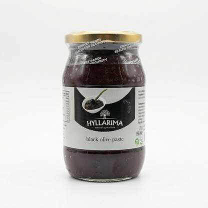 Jar of Hyllarima black olive paste on a white background
