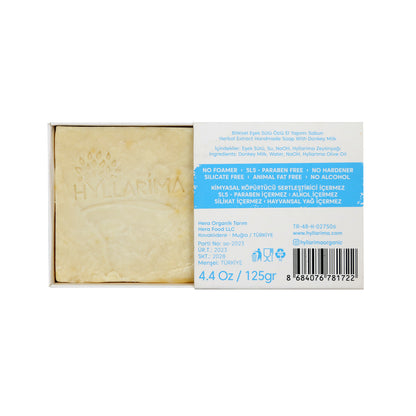 Bar of soap with packaging displaying product details on a white background