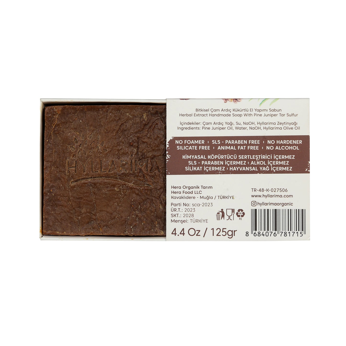 Bar of pine juniper natural soap with a label on a white background