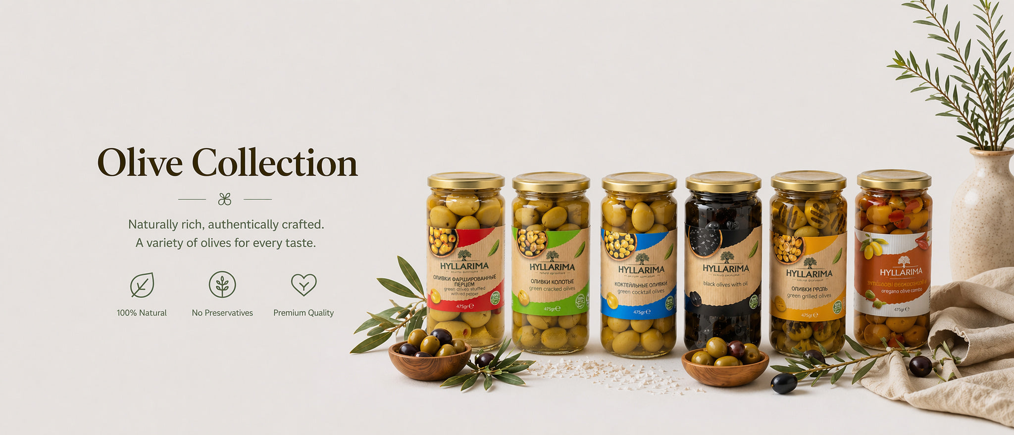 Collection of olive jars with labels on a light background
