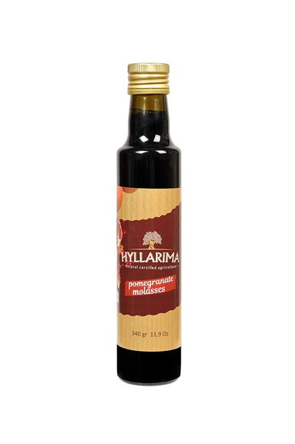 Bottle of Hyllarima pomegranate molasses on a white background