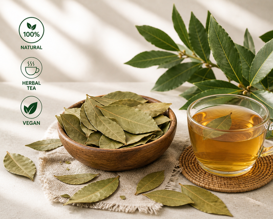 Bowl of dried leaves next to a cup of bay leaf tea with green leaves, on a light background.